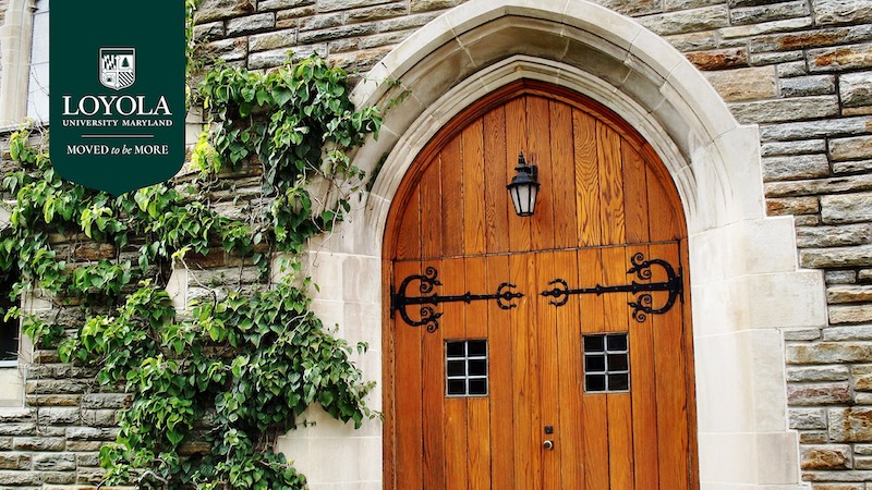 Chapel door with the Loyola logo and Moved To Be More wordmark.