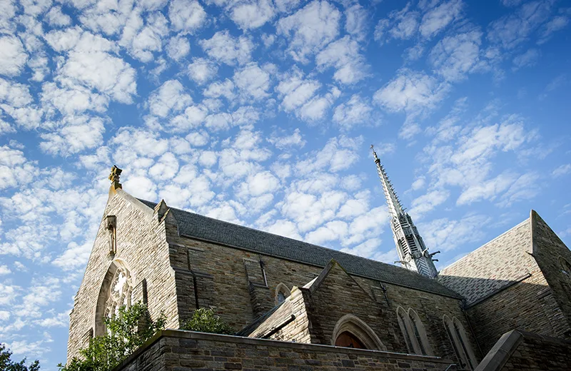 The Alumni Memorial Chapel beneath a bright blue sky