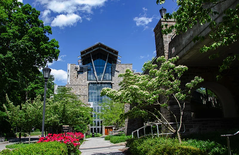 The front of the Sellinger building, surrounded by trees and flowers