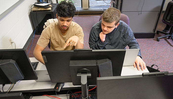 Students work together at a computer