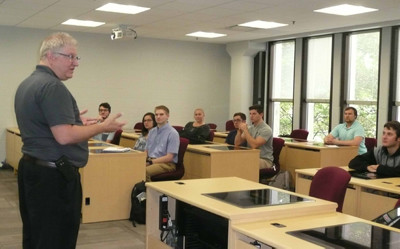 Paul McNulty answers questions from students during his presentation