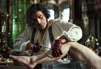 An image from a movie depicting a man sawing through a man's shin