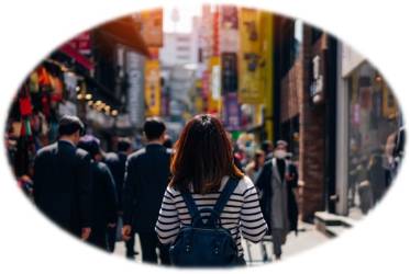 A woman in a busy city 
