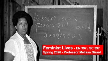 A woman in front of a blackboard