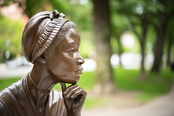 A photograph of a statue of Phillis Wheatley, a black poet who was a slave