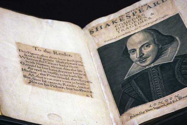 An image of a folio containing the works of William Shakespeare including a portrait of him