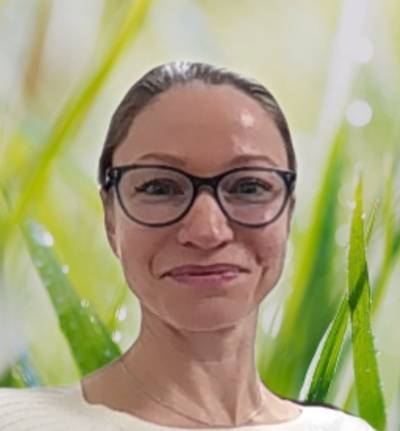 Catherine Newberry headshot with grass background