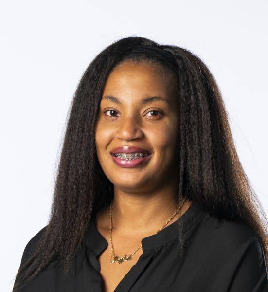 Monia Vincent headshot with black top on white background