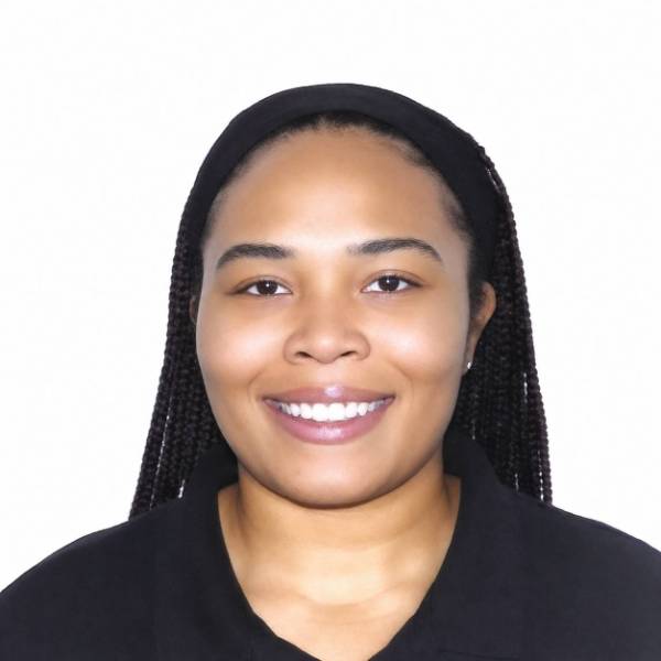 Headshot of Cierra Winkey in black shirt and headband over braids