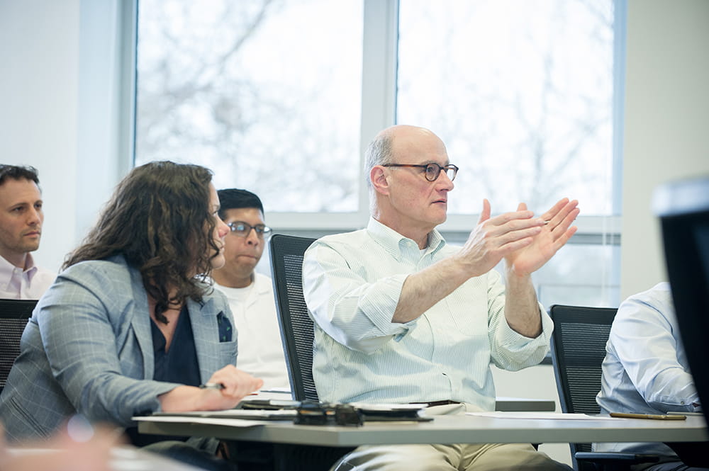 A mature student participates in a classroom discussion