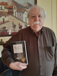 Picture of Professor Ward with copy of new edition of Roque Moreno