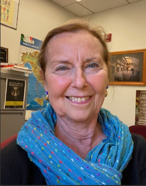 Giuliana Risso-Robberto smiling directly at camera wearing a blue scarf