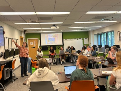 Ana Gomez-Perez Presenting to a group of college students