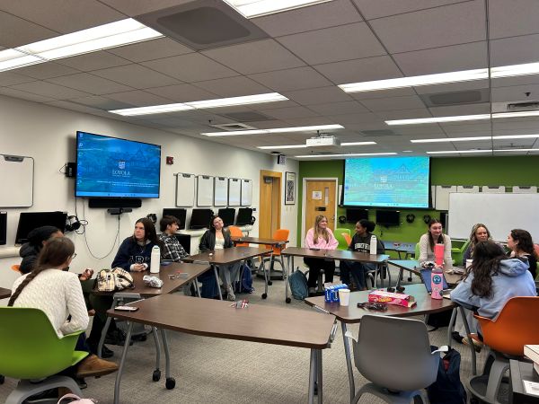 students at tables in the LLC