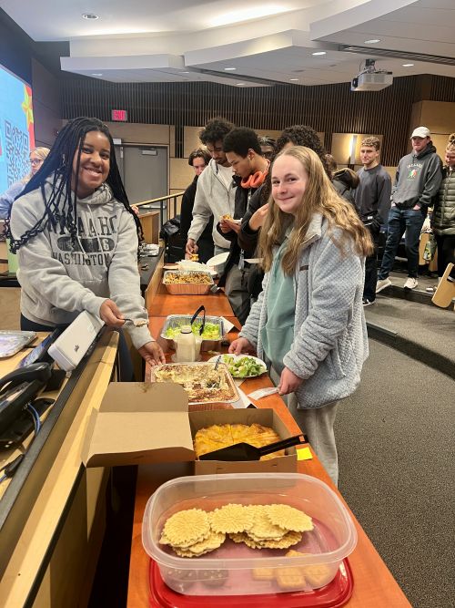 students posing with food