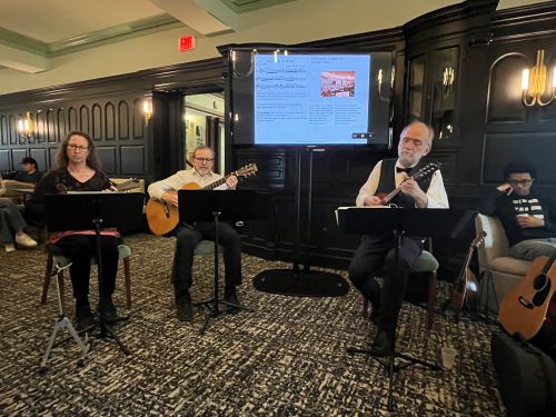 three musicians playing music