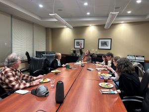 Brian Turner having lunch with faculty and college students