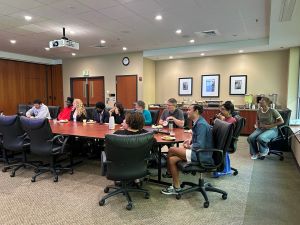 college students sitting around large table