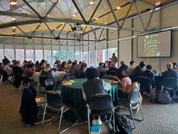 people eating around several round tables