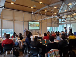 David Carey presenting to a large crowd