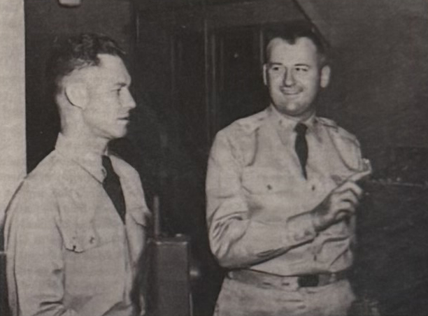 Major Woodrow Jordan (left) Inspects Radios with Lt. Colonel Ralph E. Vandervort (right).