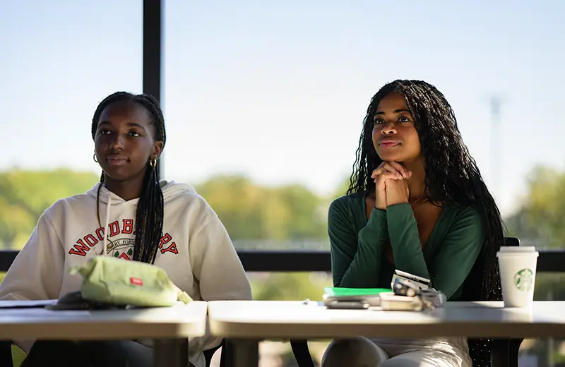 Two students listen during a class
