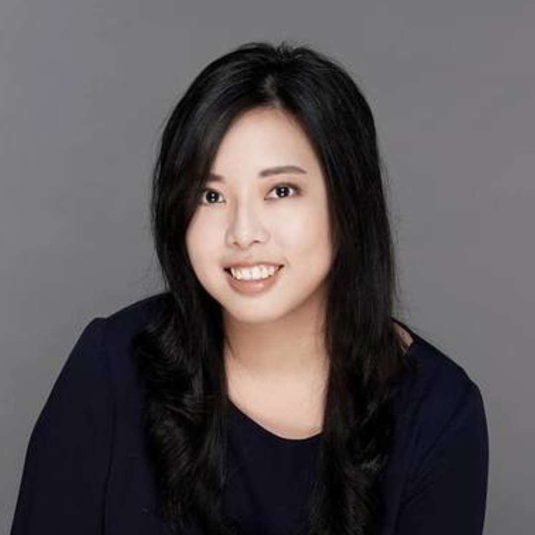 Headshot of Grace Liu smiling with a grey background