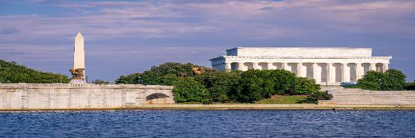 A scenic image of two national monuments in Washington, D.C. with water in the foreground