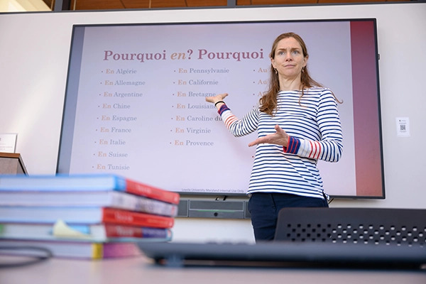 Professor explains French vocabulary to students