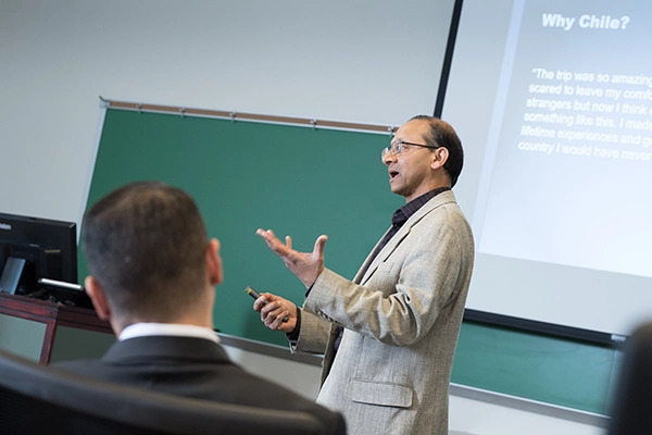 Professor engages discussion with students