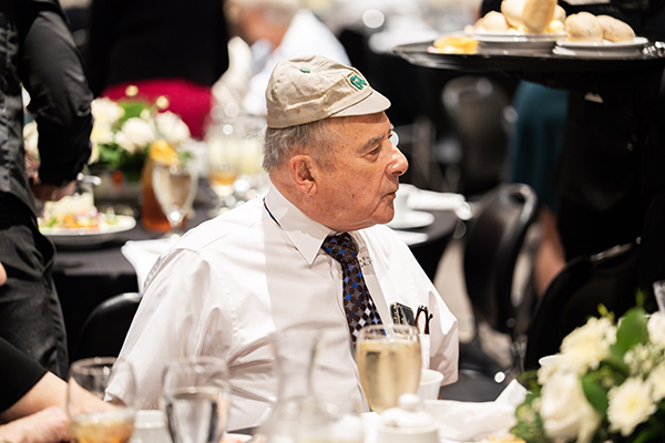 A member of the Class of 1964 proudly wears his first year student beanie