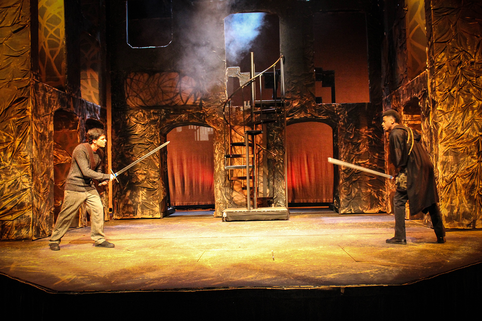 Actors square off for combat during a scene in a Loyola production of Macbeth