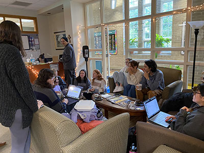 group of students in conversation at a cohn hall cafe