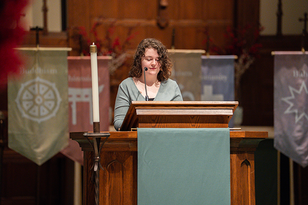 Student reading a prayer during HARPS 2025