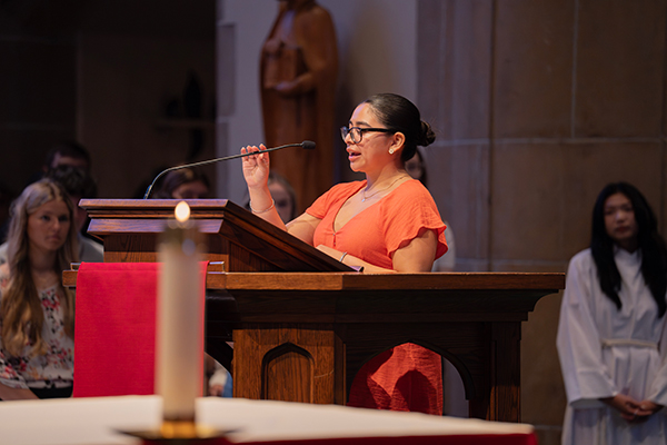 Student reading for Mass of the Holy Spirit 2024