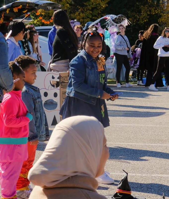 Neighborhood residents gather for a day of fun and festivities.