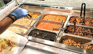 Serving counter with burrito fixings