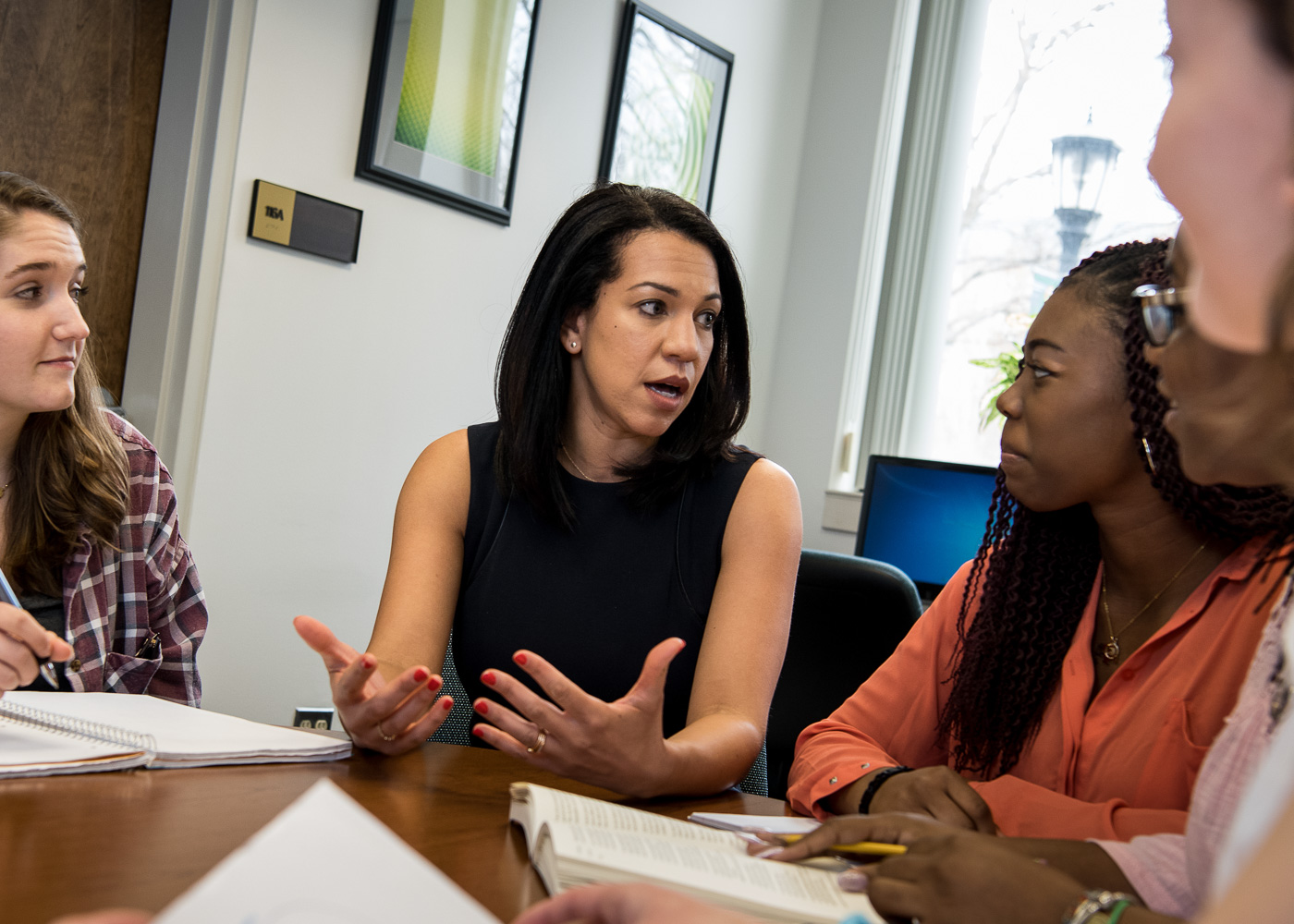 Professor engaging with students in a classroom