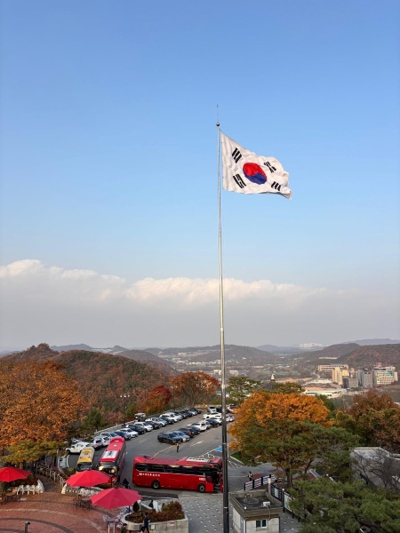 Korean flag flying over a landscape