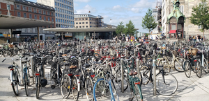 Hundreds of bikes locked up to bike posts.