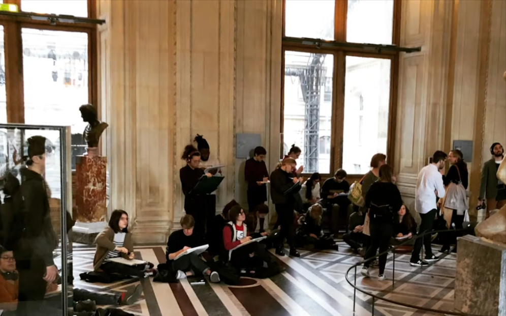 French study abroad students work in museum. - Press enter to play
