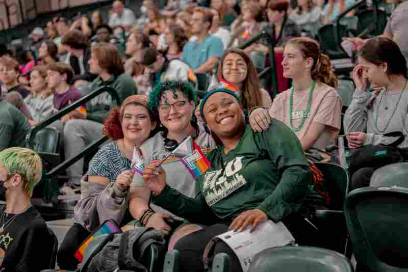 Students smile at the LGBTQ sport event