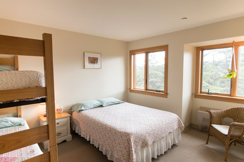 View of Sweet William room with full bed and bunk bed