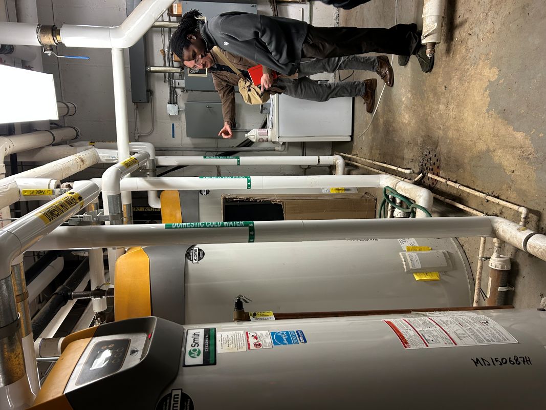 Loyola Clean Energy Intern and Auditor analyze campus water heaters