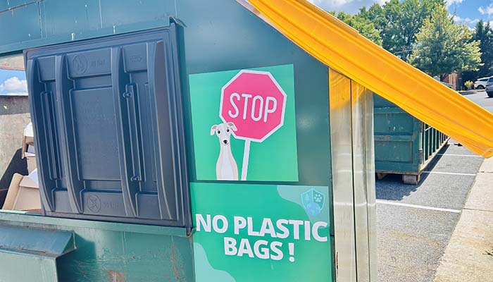 Photo of waste bin and sign that says stop no plastic bags