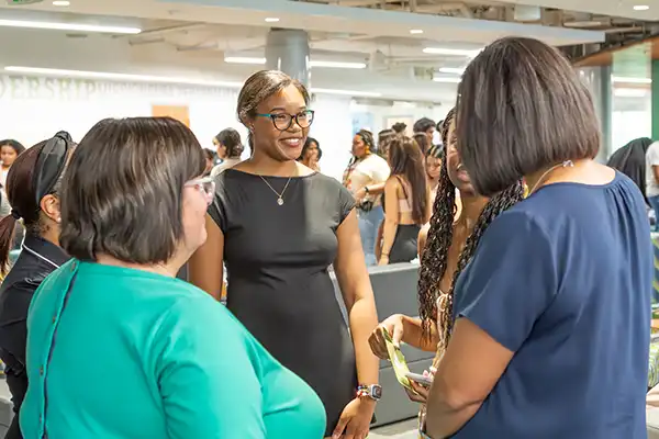 Student meets with faculty and staff during Thrive Center event