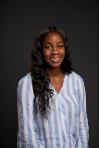 Ejuma smiling in headshot