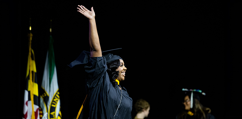 Student walks across stage