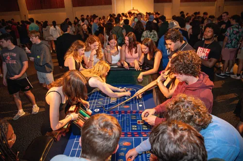 Big group of students play a casino game at orientation