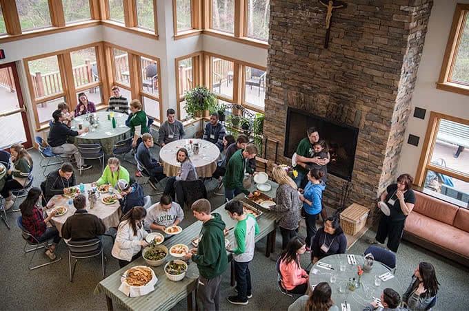 Birds-eye view of students eating in the retreat dining hall